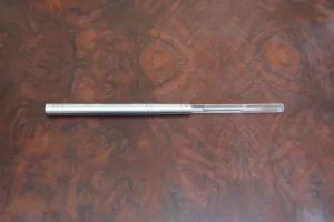 Analemma water wand on a wooden surface