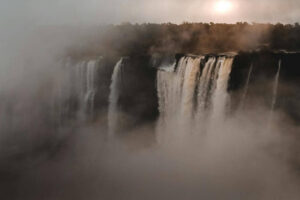 Waterfall with mist and trees in the background