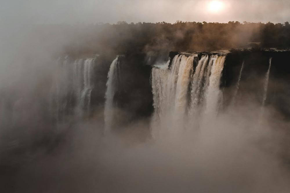 A waterfall with mist showing a charge and The Lenard Effect